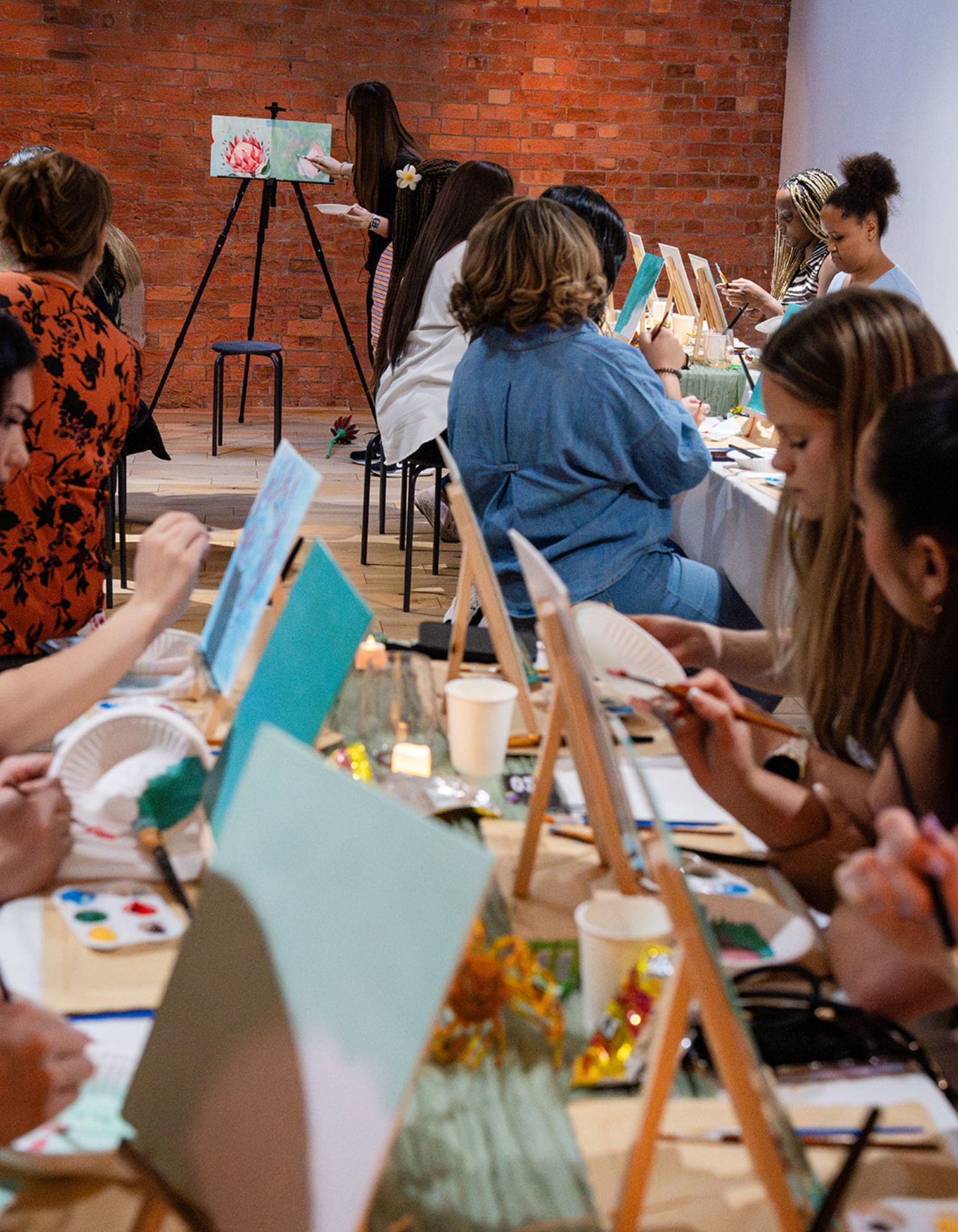 Guests painting together at a relaxed ArtBySashka creative event